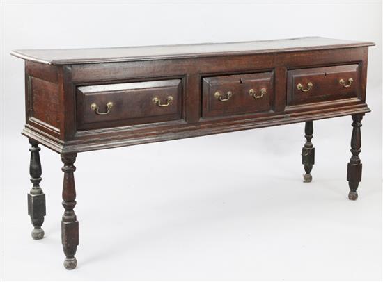 An early 18th century oak dresser base, W.6ft 11in. D.1ft 6in. H.2ft 10in.